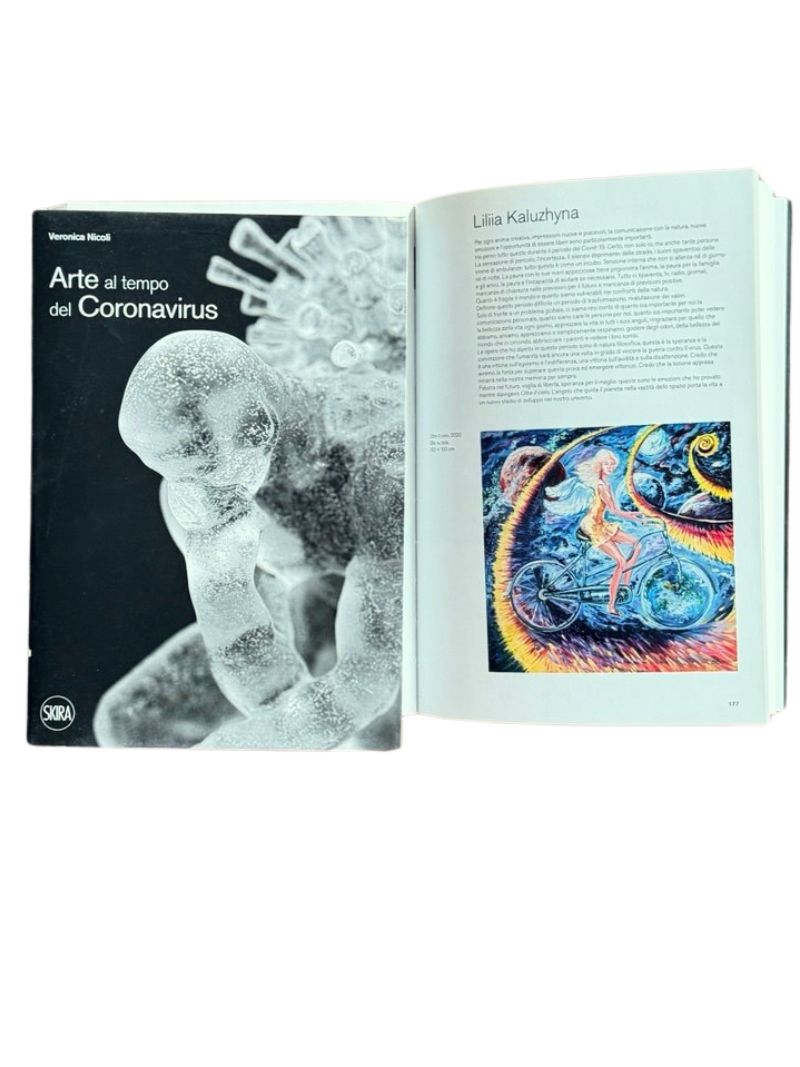 SKIRA catalog “Art in the Time of Coronavirus” opened to the page featuring Liliia Kaluzhyna and her painting “Beyond the Sky”.